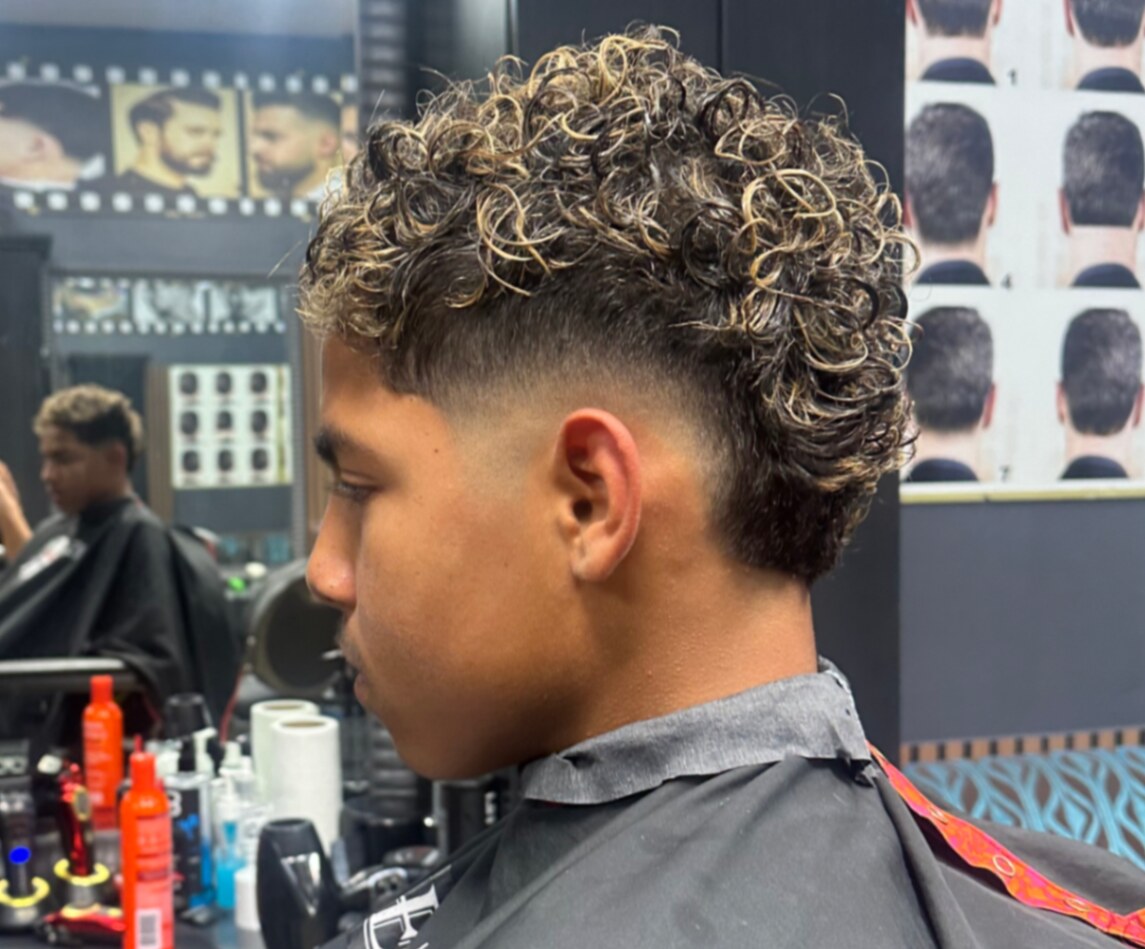 Curly top with low taper fade by Lydia at Leez Barbershop